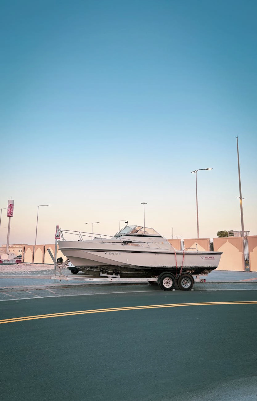 A trailer boat parked on a road.