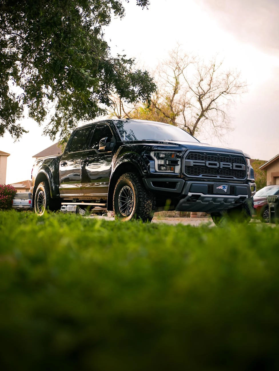 Black performance truck on a road shoulder